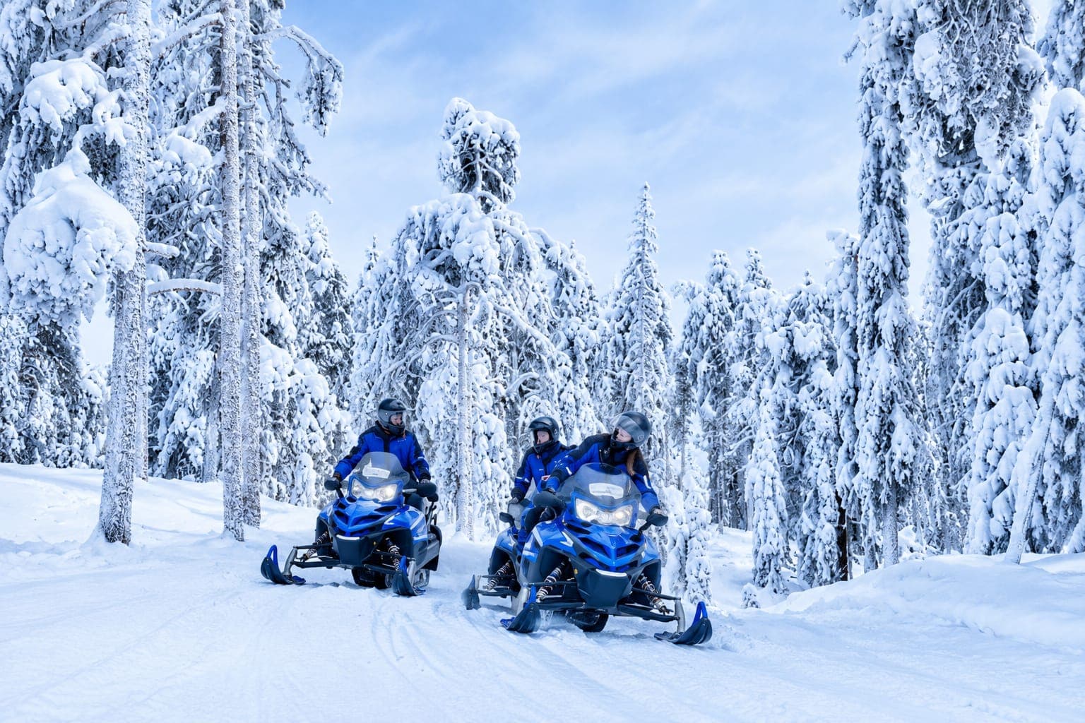 Visitors on snowmobiles among the snow-laden trees on Uludağ